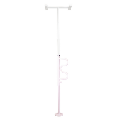 The Stander Wonder Pole is a white and pink floor-to-ceiling safety pole with a curved grab bar, designed to provide reliable support for standing and transferring at home.