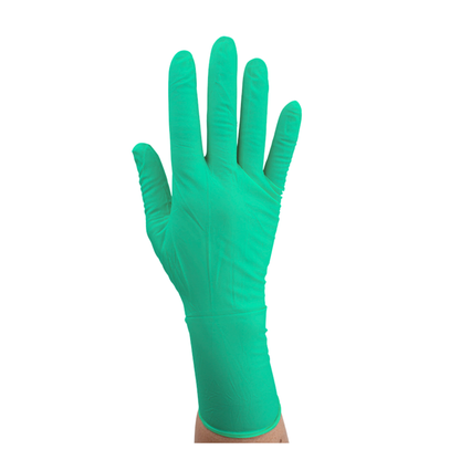 A hand wears a green Dynarex SafeTouch Sterile Nitrile Powder-Free Surgical Glove, held upright against a plain white background.