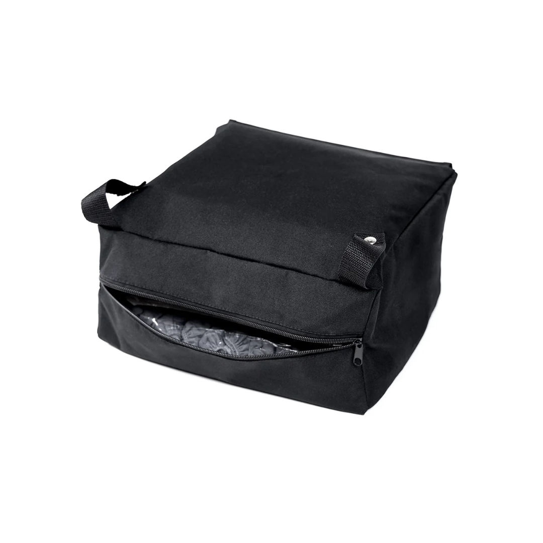 A Storage Bag For ScootNgo Lite/Voyager in black fabric features two sturdy handles and a zippered front pocket, shown partially open to reveal the interior. Ideal for carrying your daily essentials on your Voyager Mobility Scooter, the bag is displayed against a plain white background.