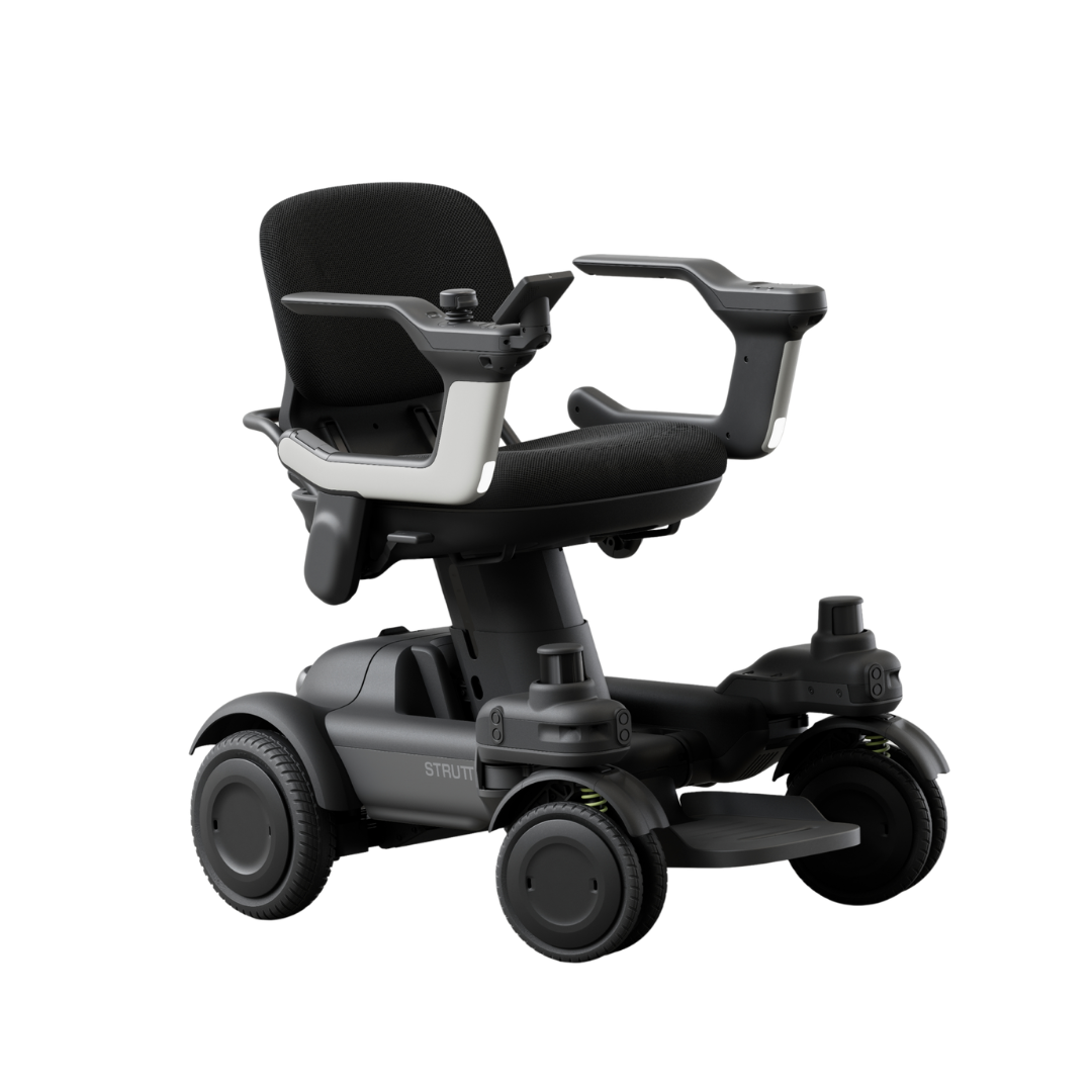 Introducing the STRUTT Electric Vehicle ev1: a modern, compact black electric wheelchair featuring armrests, a cushioned seat, and a right-arm control panel. Designed with four wheels, guided sensors for smarter driving, and enhanced maneuverability for personal transport. Built to high specifications, the STRUTT ev1 is not classified as a medical device.