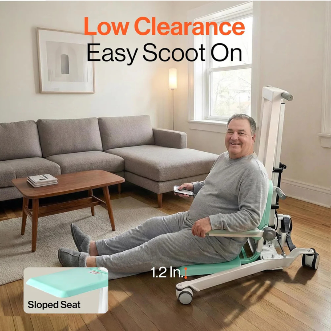A smiling man in gray loungewear sits on a SuperHandy Bariatric Transfer Floor Lift & Sit-to-Stand, designed for safe elderly transfers. Text reads "Low Clearance, Easy Scoot On." A sofa, coffee table, and window are visible behind him.