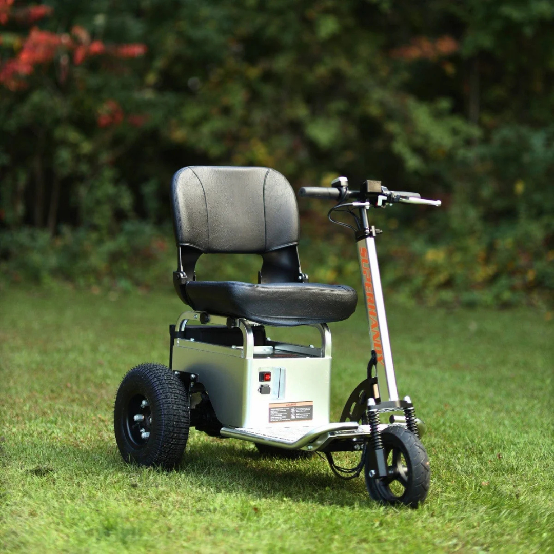 A compact, three-wheeled SuperHandy Tugger Tow Tractor—Powerful Towing Scooter with cushioned seat and backrest is parked on a grassy lawn among trees and lush foliage.