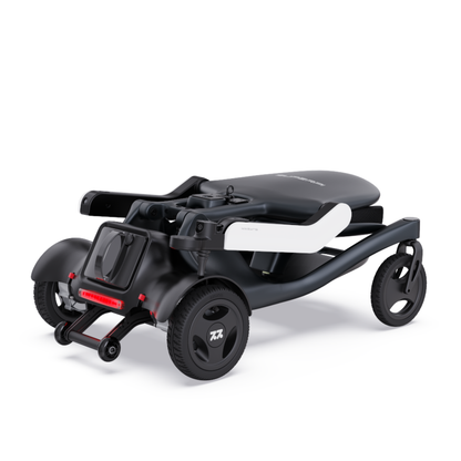 The Superpi P2 Portable Electric Wheelchair is a compact black three-wheeled folding model with modern design, shown partially folded on a white background. Ideal for convenience and style seekers. Note: Color options are limited.
