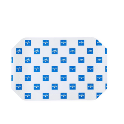 The Medline SureSite Window Transparent Film Dressing is a rectangular adhesive patch with rounded corners for catheter site protection, covered by a white backing with small blue squares that have a white cross and text.