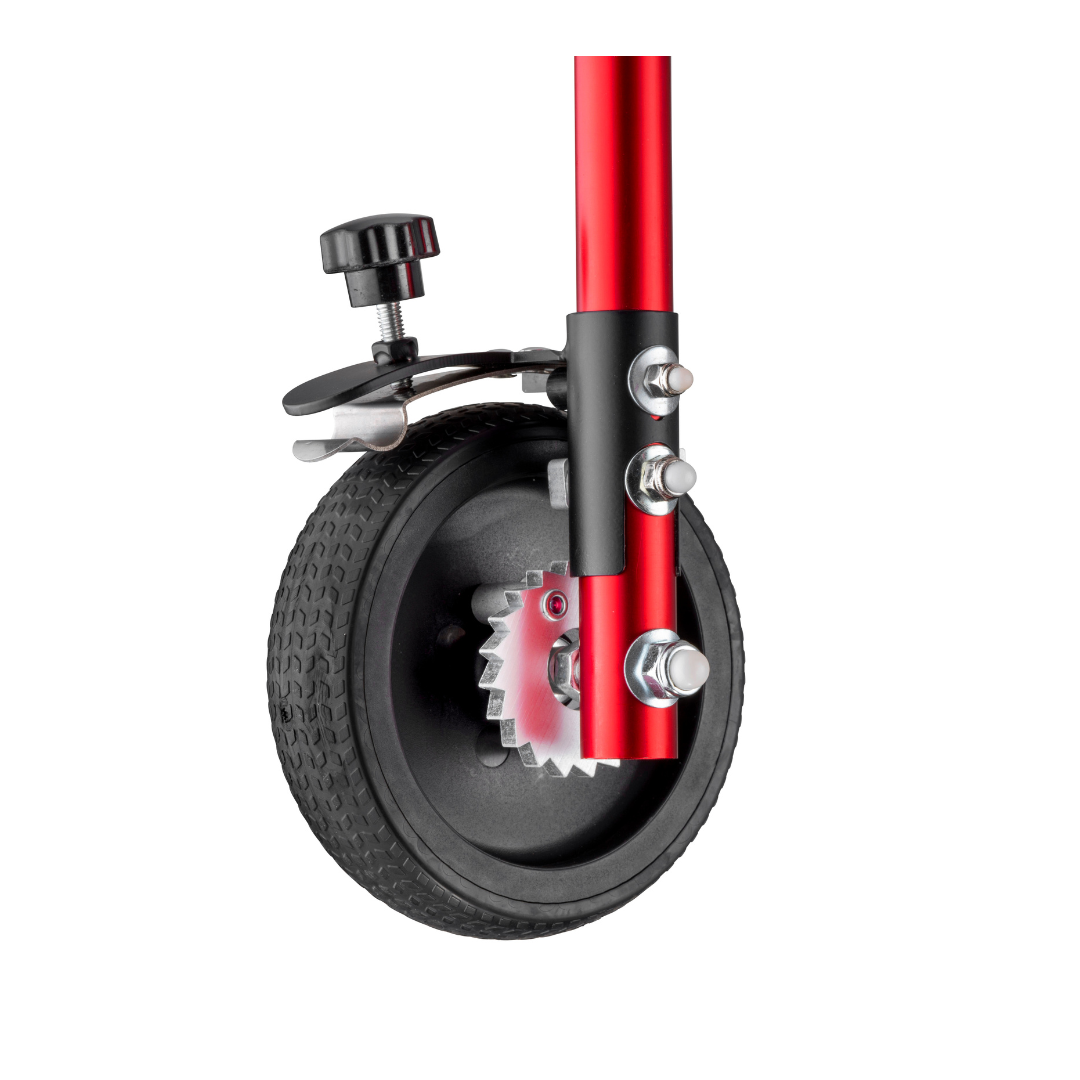 Close-up of the Tension Control for Klip Pediatric Walker Rollators: a small black rubber wheel mounted on a red metal frame with bolts, featuring an adjustable tension knob and gear mechanism. Shown against a white background.