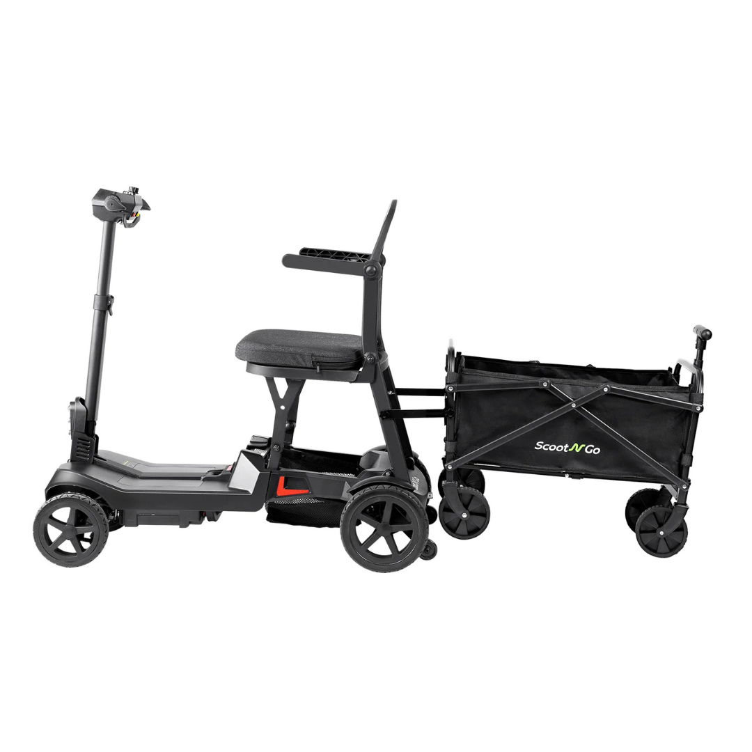 A black mobility scooter is connected to a black collapsible Trailer For ScootNgo Lite/Voyager, designed for transporting items or groceries. The setup resembles a scooter trailer, with both vehicles featuring four wheels and shown from the side on a white background.