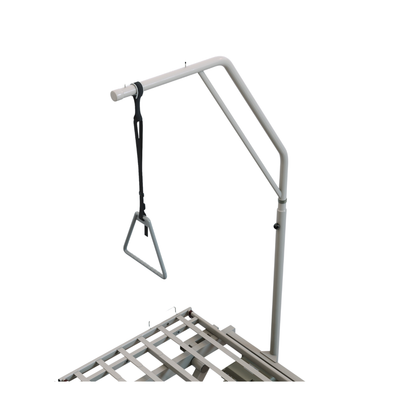 The Trapeze | Invacare CS600 Bed is a white hospital bed frame equipped with an overhead trapeze bar and a hanging triangle grip, providing patients with a practical aid for moving or repositioning themselves.