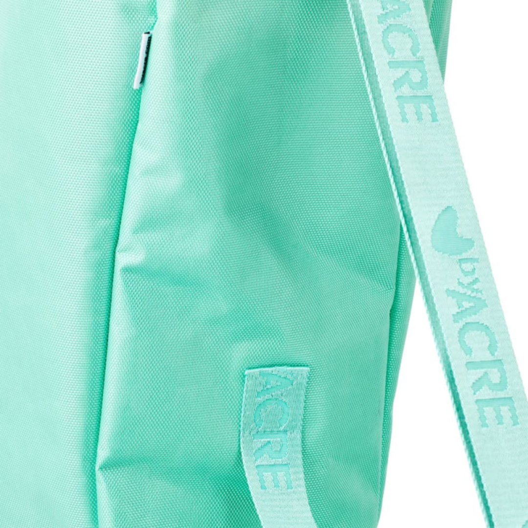Close-up of the Travel Bag For The byAcre Nordic Pioneer Rollator in mint green, showcasing textured fabric, a zipper, and dual ACRE-branded straps—perfect for protecting your rollator on the go.
