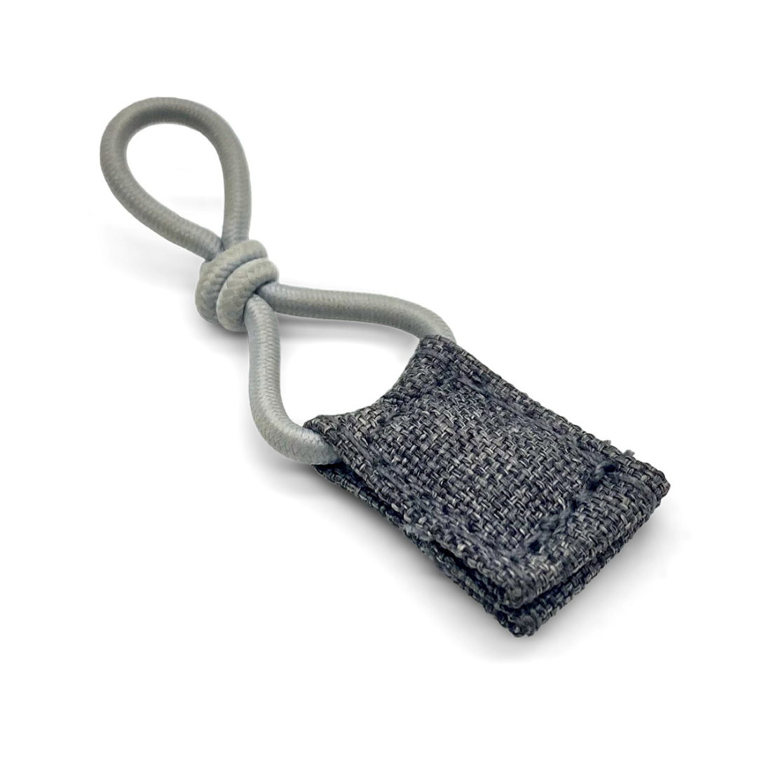 A gray fabric zipper pull with a looped elastic cord and a textured tab—perfect as a spare part or maintenance accessory for your byACRE Carbon Ultralight Rollator.