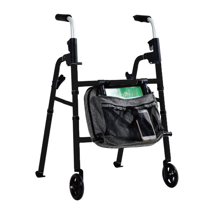 The Triumph Mobility Essentials Walker with Seat is a black, lightweight walker featuring front wheels and top grips for easy mobility. It includes a grey accessory bag that holds a green book and phone. Its foldable design ensures convenient storage and transport.