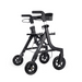 The Triumph Mobility Essentials Compact Lightweight Rollator boasts a sleek black frame with four wheels, adjustable handles, and a convenient seat, designed for mobility assistance with easy portability and use.