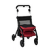 The Triumph Mobility Essentials Lightweight Shopping Rollator with Seat features a red and black foldable design, sturdy frame, four wheels, padded handle for comfort, and a large front storage bag for ample space. This lightweight aid is perfect for convenient shopping trips.