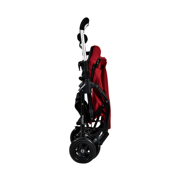 A red collapsible stroller stands upright on its wheels, handlebar visible at the top. It appears compact and lightweight, similar to a Triumph Mobility Essentials Lightweight Shopping Rollator with Seat, featuring black wheels for stability and neatly tucked fabric in the frame.