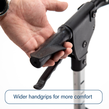 A person’s hand rests on the wide, textured handgrip of the Triumph Mobility Escape Rollators - One Handle Fold (only 15 lbs). Text at bottom: Wider handgrips for more comfort.