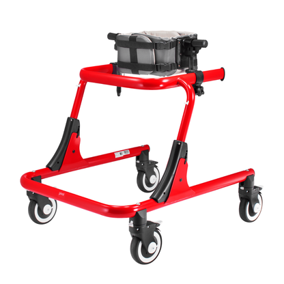 The Trunk Support For Pivot Gait Trainer is a red pediatric mobility aid with four black-and-white wheels and a gray cushioned harness for trunk support, offering sturdy upper-body stability for mobility assistance.