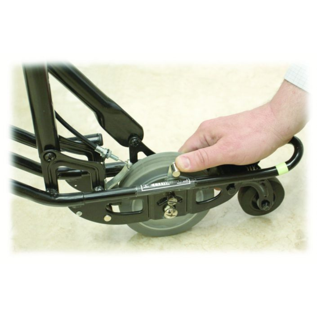 A hand adjusts a screw near the wheel of a black U-Step Neuro Walking Stabilizer—Rolling Walker with Reverse Braking, designed for people with neurological conditions, on a light surface.