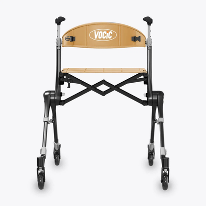 A front view of the Ultra-Compact PackGo Rollator Walker with Backpack (VOCIC Z35) shows a foldable rollator featuring a tan fabric seat and backrest labeled “VOCIC,” four wheels, and a black and silver metal frame.