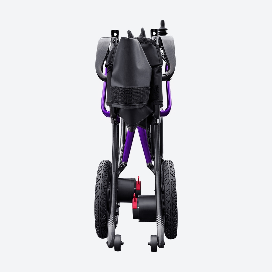 A rear view of the folded Forcemech Ultralite G20 PRO Carbon-Fiber Power Wheelchair highlights its modern black and purple frame, large rear wheels, small front wheels, and a black storage pouch on the back—a compact power wheelchair crafted from carbon fiber for style and convenience.