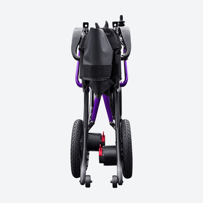 A rear view of the folded Forcemech Ultralite G20 PRO Carbon-Fiber Power Wheelchair highlights its modern black and purple frame, large rear wheels, small front wheels, and a black storage pouch on the back—a compact power wheelchair crafted from carbon fiber for style and convenience.