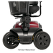 Close-up of the front wheels and base of the Pride Mobility Victory® Platinum Bariatric 4-Wheel Scooter, showcasing EZ Turn technology, a red frame, black tires, a footrest, and partial views of the seat and basket above.