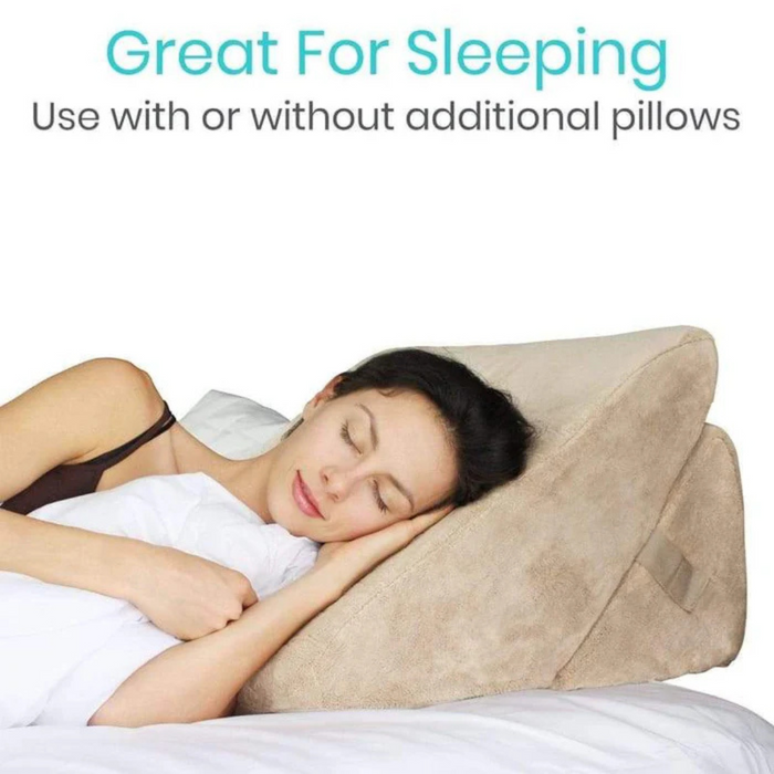 A woman sleeps on the Vive Health Foam Bed Wedge, wrapped in a white blanket. Text above reads, Great for Sleeping. 3-in-1 adjustable incline - use with or without additional pillows.
