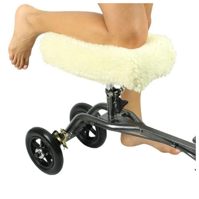 The Vive Health Faux Sheepskin Knee Walker Pad Cover ensures a persons knee rests comfortably on their knee walker scooter. The black scooter features a nonslip design and four wheels, offering excellent mobility assistance.