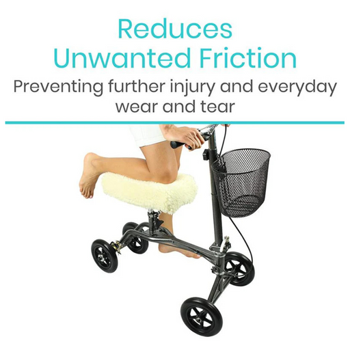 A person uses a black knee walker with a comfy white cushion. Text states, Reduces Unwanted Friction—Preventing further injury and everyday wear and tear. A black basket on the handle features a faux sheepskin cover for added comfort. Product: Vive Health Faux Sheepskin Knee Walker Pad Cover.