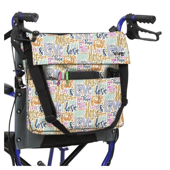 The Vive Health Portable Mobility Bag with Shoulder Strap features a colorful, waterproof nylon design adorned with words like hope, faith, and love. Adjustable straps allow easy attachment to the walkers black handles on its metal frame.