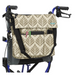 The Vive Health Portable Mobility Bag with Shoulder Strap is a stylish beige and brown patterned bag made from waterproof nylon. It attaches to a walker using adjustable straps, offering multiple pockets for pens, glasses, and small items. The walker has black handles on a blue frame.