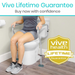 A person is seated on a toilet equipped with Vive Health Toilet Safety Rail with Legs For Extra Support, ensuring bathroom stability. The text shows Vive Lifetime Guarantee and Buy now with confidence, alongside a lifetime guarantee emblem, promising universal fit for everyone.