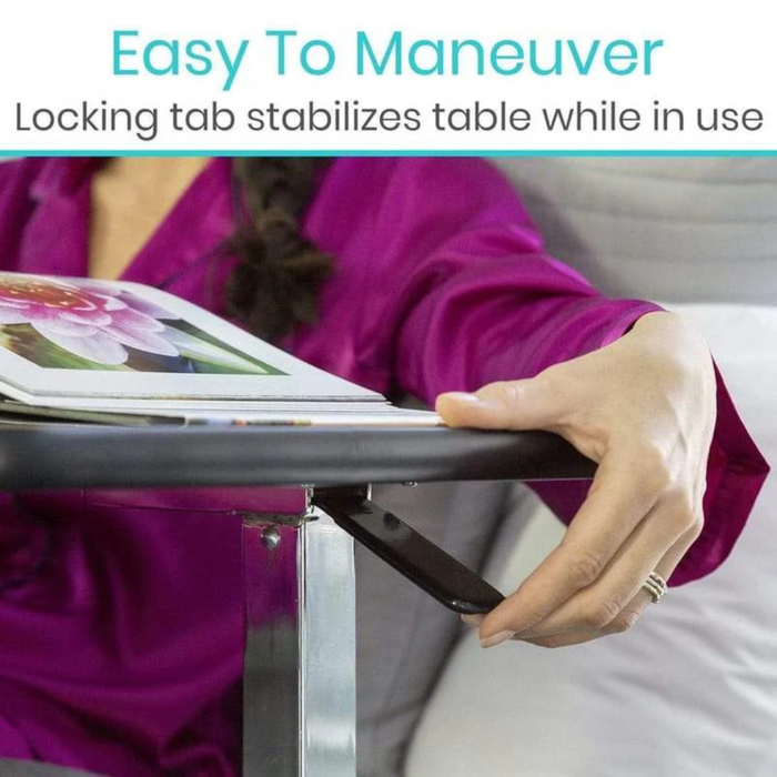 A person in a purple shirt adjusts the black locking tab under the Vive Health Rolling Overbed Table - Height Adjustable to stabilize it. Text above says, Easy To Maneuver - Locking tab and smooth height adjustments ensure stability during use.