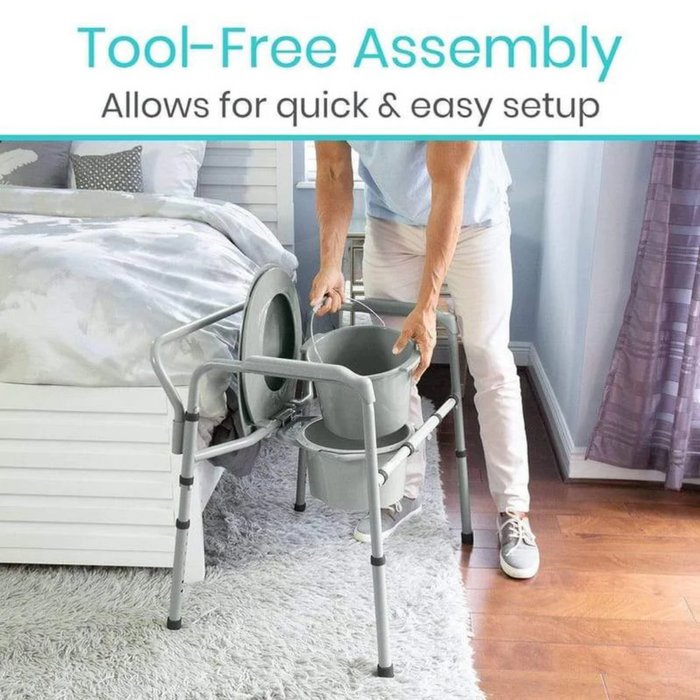 A person is assembling a Vive Health Freestanding Bariatric Steel Bedside Commode - 500 lb Cap next to a bed with a gray and white comforter. Text reads, Tool-Free Assembly Allows for quick & easy setup. The room has wooden flooring and purple curtained windows.