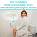 A woman in a robe uses the Vive Health Hinged Toilet Seat Riser, which adds 3.5. Text: Comfortably alleviate knee/hip pain. Ideal for seniors, post-surgery, & recovery. Easy installation provides enhanced bathroom safety solutions.