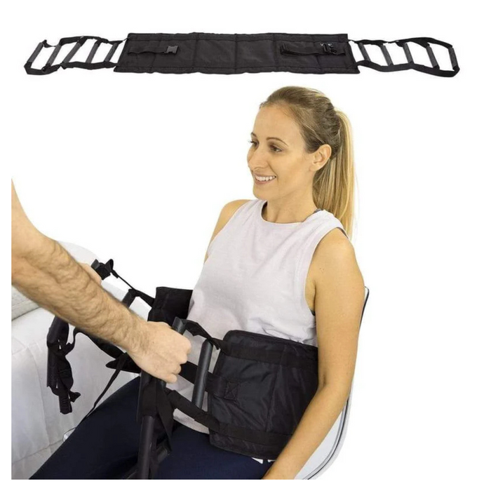 A person with limited mobility sits while wearing the Vive Health Transfer Sling, a versatile standing and transfer aid. Another person adjusts the straps for a secure transfer. The black sling is shown fully extended against a plain white backdrop.