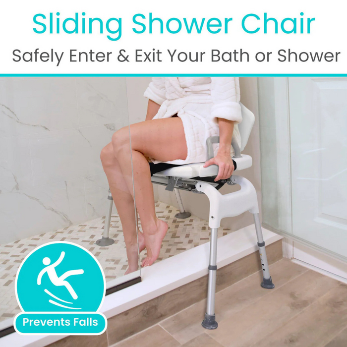 A person in a bathrobe sits on the Vive Health Sliding Bathtub Transfer Bench, made from rust-resistant aluminum, at the showers edge. The bench spans the tub for safe entry and exit, providing essential assistance with a corner symbol highlighting fall prevention features.