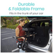 Someone places a folded Vive Health Folding Portable Knee Walker, equipped with all-terrain wheels, into an open car trunk. Text highlights Durable & Foldable Frame and Fits in the trunk of your car. The scene is set in a parking lot with trees in the background.