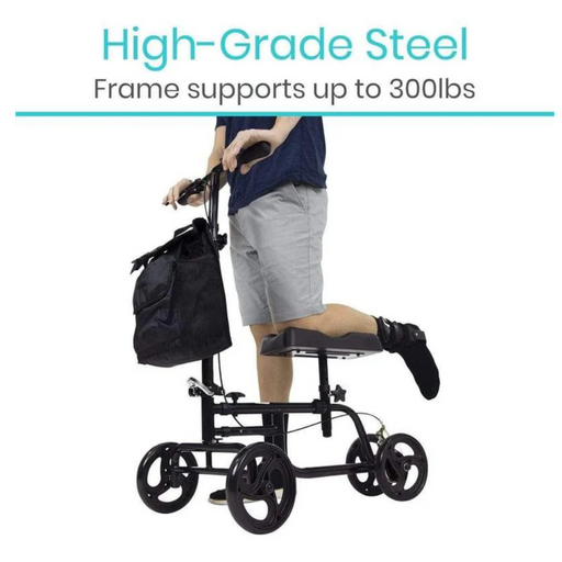 A person is using a Vive Health Folding Portable Knee Walker with all-terrain wheels, a high-grade steel frame supporting up to 300 lbs, wearing a protective boot on one leg and has a bag attached to the handlebars.