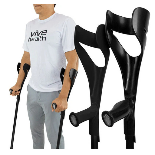 A person in a white Vive Health t-shirt uses Vive Health Forearm Crutches, highlighting their lightweight and height-adjustable design for optimal mobility assistance. Two crutches are positioned in the foreground.