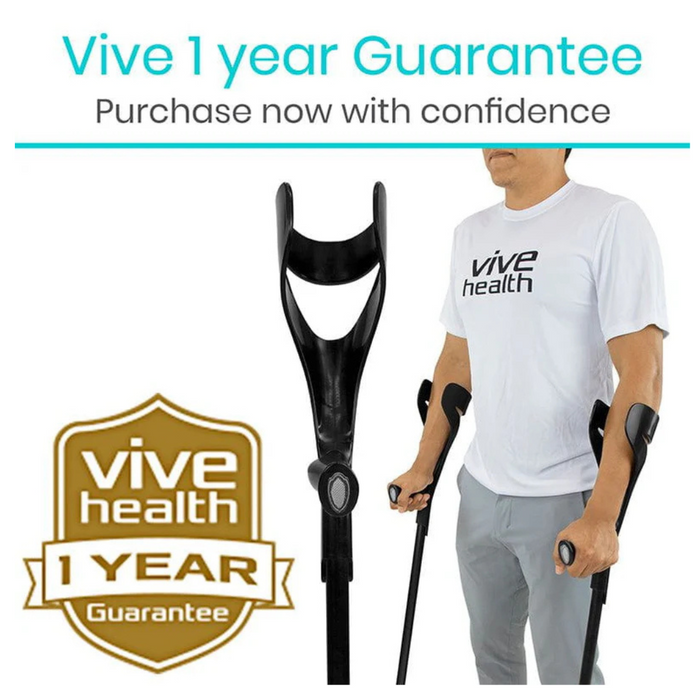 A person using black Vive Health Forearm Crutches, lightweight and height adjustable, stands wearing a white vive health t-shirt. The image showcases a 1 Year Guarantee badge with the phrase Purchase now with confidence.