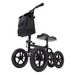 The Vive Health All Terrain Knee Walker features XL 12 treaded tires, a comfortable knee pad, handlebars with a small black bag, and offers superior stability. It is an ideal crutch alternative for those with leg injuries needing enhanced mobility.