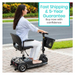 A person in a light blue shirt and white pants relaxes on a Vive Health 3 Wheel Power Mobility Scooter - Long Range. A sign above reads, Fast Shipping & 5-Year Guarantee. Buy now with confidence, highlighting its excellent maneuverability and battery life.