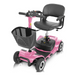 The Vive Health 4 Wheel Electric Portable Mobility Scooter is pink with a black seat, swivel seating, and armrests. It features a large front black basket, four wheels, and a steering handle. Its compact modern design includes a long-range battery for extended travel.