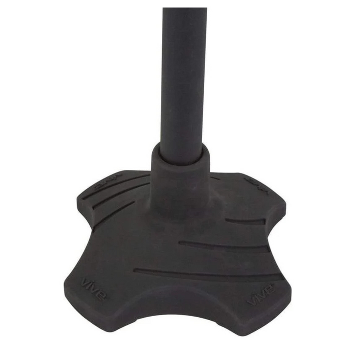 The image features the bottom of a Vive Health Standing Cane Tip, which converts your cane into a stand-alone support with a wide, durable rubber tip. Its star-like shape with grooves provides stability and is embossed with Vive for a secure grip.