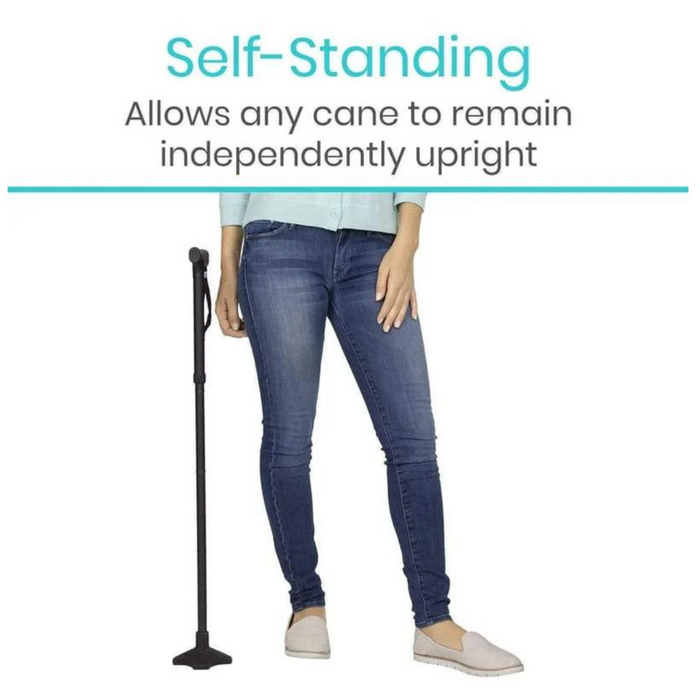 A woman in jeans and a light blue top displays the Vive Health Standing Cane Tip, a black quad cane with a durable rubber base that stands upright independently. Text reads: Self-Standing: Convert Your Cane Into A Stand-Alone Cane.