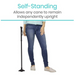 A woman in jeans and a light blue top displays the Vive Health Standing Cane Tip, a black quad cane with a durable rubber base that stands upright independently. Text reads: Self-Standing: Convert Your Cane Into A Stand-Alone Cane.