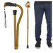 A person holds a Vive Health Folding Offset Cane, made of lightweight aluminum with a gold finish, black grip, and wrist strap. The adjustable cane is shown folded and extended. They wear dark blue pants and black shoes, visible only from the waist down.