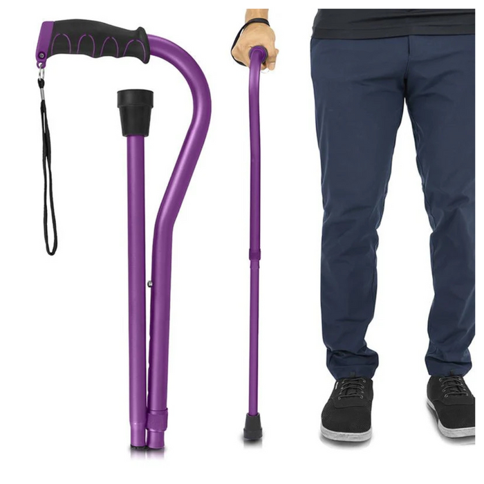 A person holds the Vive Health Folding Offset Cane, showing its adjustable feature and non-slip cane tip. The cane is folded with a purple design, black grip, and strap. The person wears blue pants and black shoes.