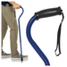 A person in khaki pants and gray shoes uses the Vive Health Offset Bariatric Cane, which is blue with an ergonomic handle and a black wrist strap. The image showcases the canes design, heavy-duty support, and functionality, supporting up to 600 lbs.