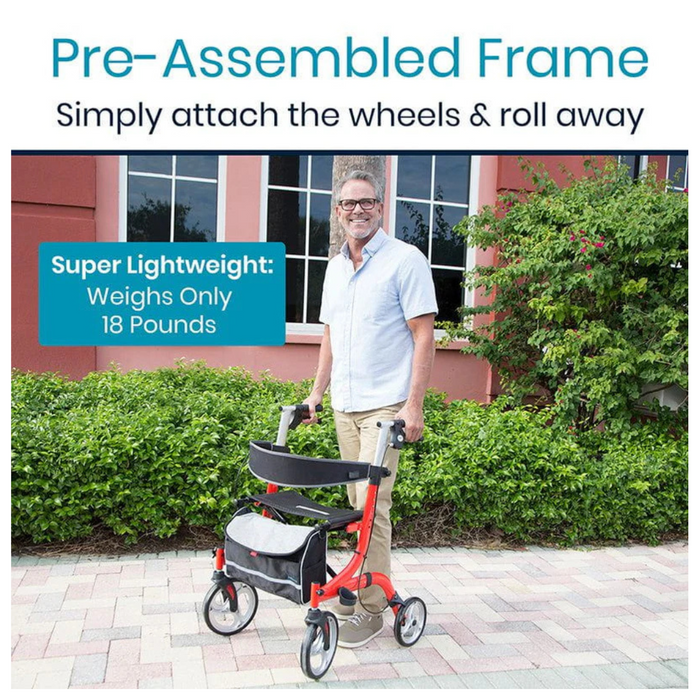 A man smiles outdoors with the Vive Health Euro-Style Everglide Rollator, a lightweight red walker with adjustable handles and a basket. Its pre-assembled 18-pound aluminum frame stands against green bushes and a red building.