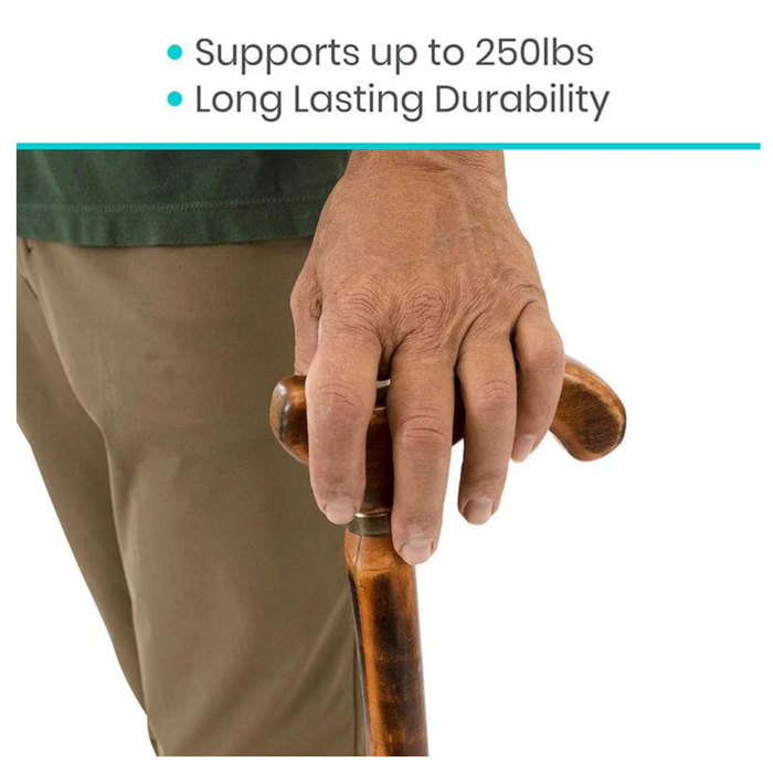 A person using the Vive Health Wooden Cane with an ergonomic handle, designed for long-lasting durability and strong enough to support up to 250 lbs, ensuring reliable use for years.